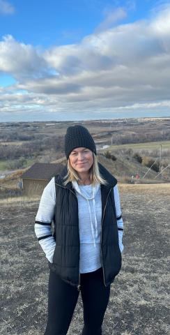 Lisa in front of a landscape