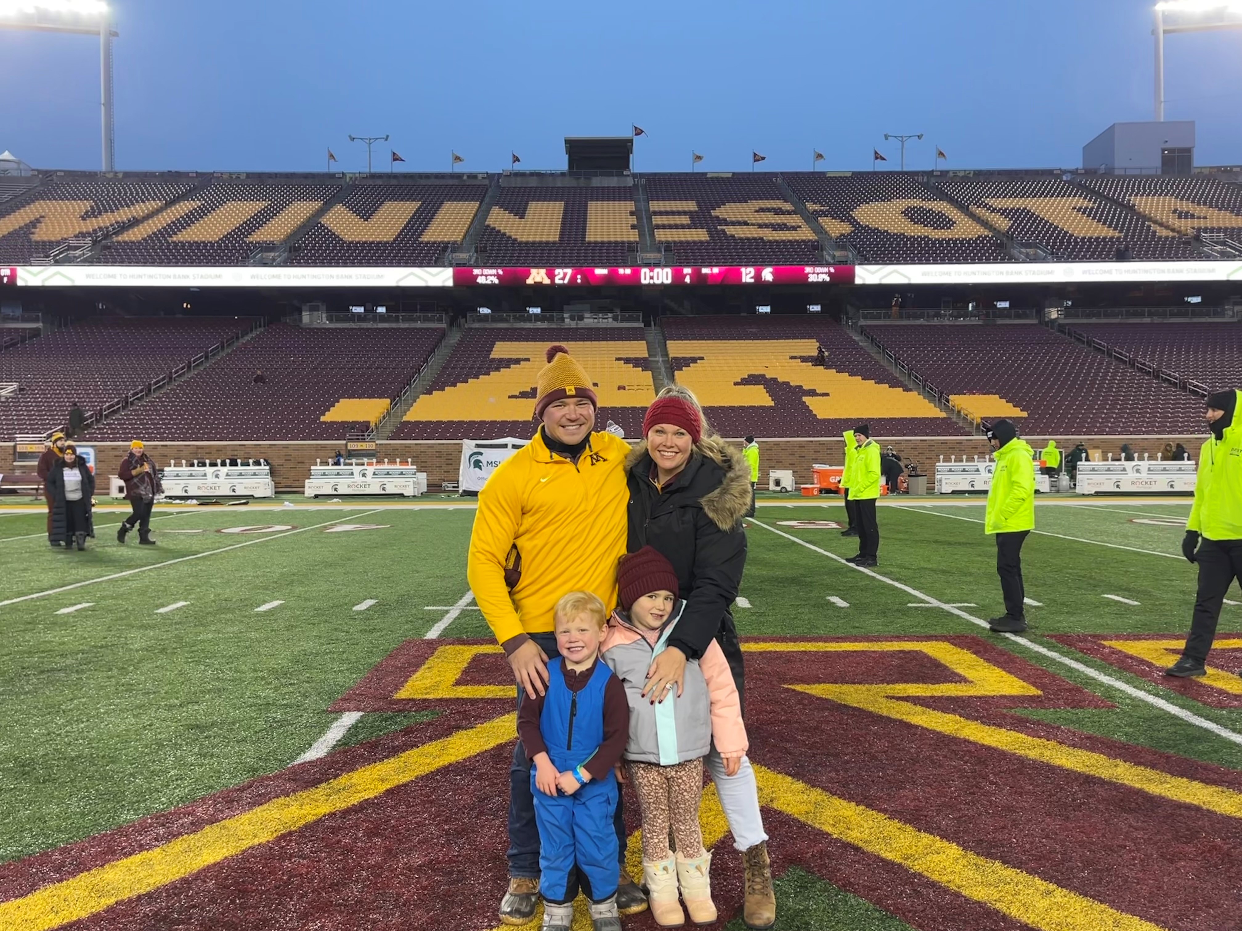 Anna and Brad Jankord with children at Minnesota Golden Gophers Game