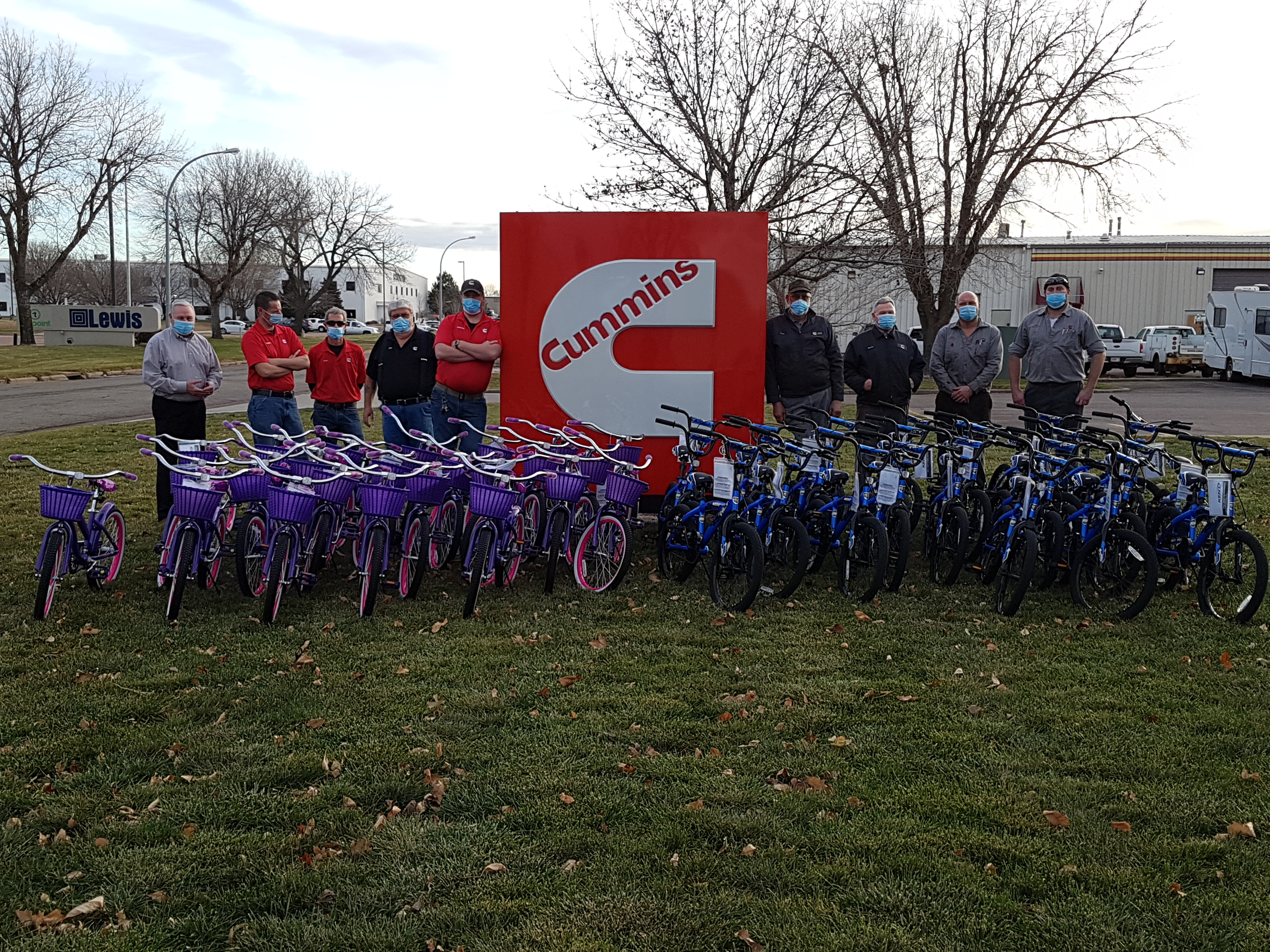 Cummins employees standing alongside 50 bikes they assembled for Sioux Empire United Way funded agencies.