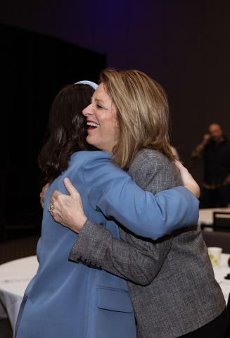 Kim Burma, 2025 Campaign Chair and Sioux Empire United Way Campaign Director, Taryn Latza embracing