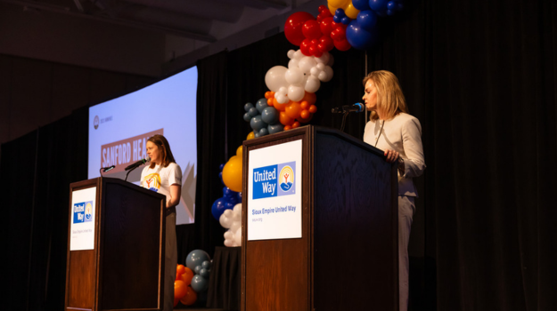 Kate Kotzea and Pam Hanneman presenting at the 2024 Sioux Empire United Way Thank You Event