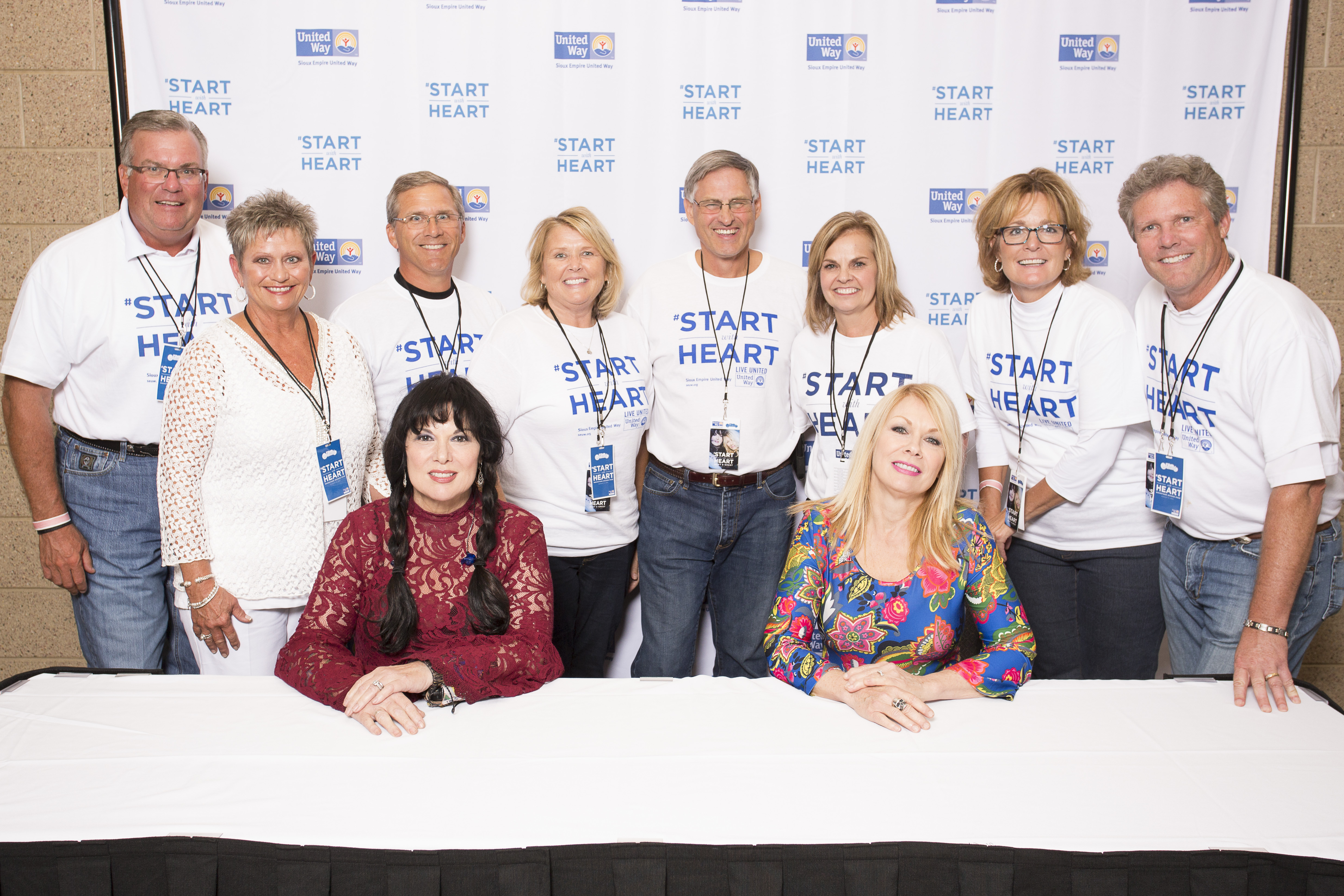 Group Photo of Pam Hanneman, Heart, and others at the Sioux Empire United Way Heart Concert 